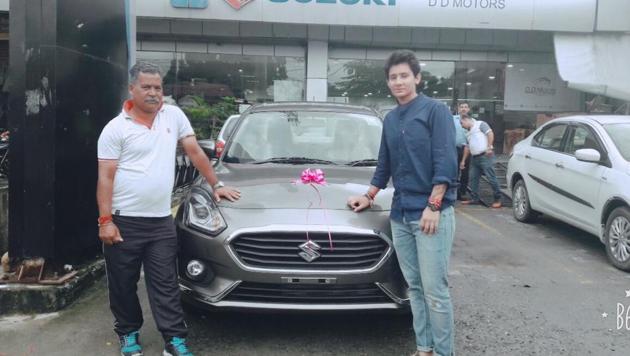 Mansi Joshi gifted a car to her coach Vrinder Rautela at her hometown in Dehradun.(HT Photo)