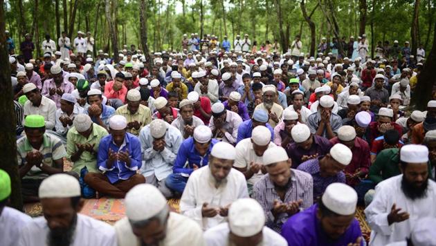 Rohingya refugees offer Eid prayer at Kutupalong refugee camp in Ukhiya near the Bangladesh-Myanmar border on September 2, 2017. Rohingya refugees marked Eid on September 2 with feasts and prayers in Bangladesh's Cox's Bazar after deadly communal violence in neighbouring Myanmar.(AFP)