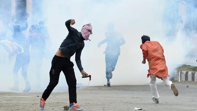 A Kashmiri youth throws a stone during clashes between protesters and security forces in Srinagar after Eid prayers on Saturday, September 2, 2017. (AFP) A Kashmiri youth throws a stone during clashes between protesters and security forces in Srinagar after Eid prayers on Saturday, September 2, 2017. (AFP)