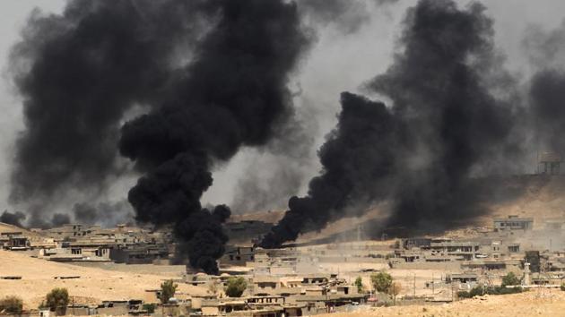 Smoke billows from the village of al-Ayadieh, near Qubuq, north of Tal Afar, as Iraqi forces advance during the ongoing operation to retake the area from the Islamic State (IS) group on August 28, 2017. Some of IS fighters inside Tal Afar were believed to have fled to Al-Ayadieh, located on the road between the city and the Syrian border, where they appeared to be making a desperate last stand. (Ahmad al-Rubaye / AFP) Smoke billows from the village of al-Ayadieh, near Qubuq, north of Tal Afar, as Iraqi forces advance during the ongoing operation to retake the area from the Islamic State (IS) group on August 28, 2017. Some of IS fighters inside Tal Afar were believed to have fled to Al-Ayadieh, located on the road between the city and the Syrian border, where they appeared to be making a desperate last stand. (Ahmad al-Rubaye / AFP)