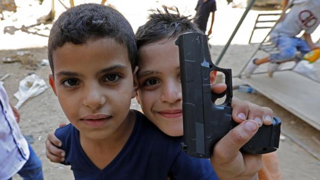 Syrian refugee children poses for a photo as they play on a street in the Palestinian Shatila refugee camp, on the southern outskirts of the Lebanese capital Beirut, on September 1, 2017, as Muslims mark the first day of the Eid al-Adha holiday. Muslims across the world celebrate the annual festival of Eid al-Adha, or the festival of sacrifice, which marks the end of the Hajj pilgrimage to Mecca and commemorates prophet Abraham's readiness to sacrifice his son to show obedience to God. (ANWAR AMRO / AFP) Syrian refugee children poses for a photo as they play on a street in the Palestinian Shatila refugee camp, on the southern outskirts of the Lebanese capital Beirut, on September 1, 2017, as Muslims mark the first day of the Eid al-Adha holiday. Muslims across the world celebrate the annual festival of Eid al-Adha, or the festival of sacrifice, which marks the end of the Hajj pilgrimage to Mecca and commemorates prophet Abraham's readiness to sacrifice his son to show obedience to God. (ANWAR AMRO / AFP)