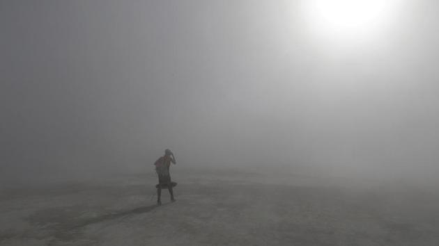 A Burning Man participant walks through a desert dust storm in formal clothes on her way to a wedding in the middle of the desert as approximately 70,000 people from all over the world attend the 3rd day of the annual Burning Man arts and music festival in the Black Rock Desert of Nevada, U.S. (Jim Bourg / REUTERS) A Burning Man participant walks through a desert dust storm in formal clothes on her way to a wedding in the middle of the desert as approximately 70,000 people from all over the world attend the 3rd day of the annual Burning Man arts and music festival in the Black Rock Desert of Nevada, U.S. (Jim Bourg / REUTERS)