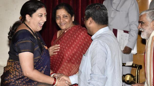 Union Minister for information and broadcasting Smriti Irani greets to Dharmendra Pradhan, Nirmala Sitharaman ,Ashwini kumar Choubey (right ) during Cabinet reshuffle at Rashtrapati Bhawan in New Delhi. (Arvind Yadav/HT PHOTO) Union Minister for information and broadcasting Smriti Irani greets to Dharmendra Pradhan, Nirmala Sitharaman ,Ashwini kumar Choubey (right ) during Cabinet reshuffle at Rashtrapati Bhawan in New Delhi. (Arvind Yadav/HT PHOTO)