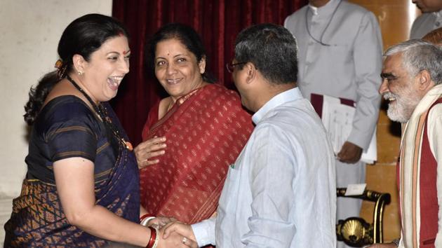 Smriti Irani greets Dharmendra Pradhan as Nirmala Sitharaman looks on during the swearing-in ceremony at the Rashtrapati Bhawan in New Delhi on September 3, 2017. PM Narendra Modi rejigged his Council of ministers for a third time since he became prime minister in 2014.(Arvind Yadav/HT Photo) Smriti Irani greets Dharmendra Pradhan as Nirmala Sitharaman looks on during the swearing-in ceremony at the Rashtrapati Bhawan in New Delhi on September 3, 2017. PM Narendra Modi rejigged his Council of ministers for a third time since he became prime minister in 2014.(Arvind Yadav/HT Photo)