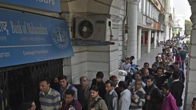 File photo of people waiting in a queue to withdraw money from an ATM in New Delhi in December 2016, a month after the government’s shock recall of high-value banknotes.(Ravi Choudhary/HT File Photo)