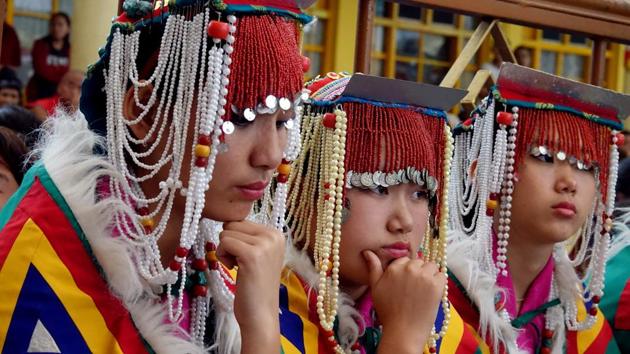 Students of the Upper TCV School in traditional costumes, waiting for their turn to perform on the occasion of the 57th Tibetan Democracy Day in main Tibtan temple in Mcleodganj near Dharamsala . (Shyam Sharma / HT photo) Students of the Upper TCV School in traditional costumes, waiting for their turn to perform on the occasion of the 57th Tibetan Democracy Day in main Tibtan temple in Mcleodganj near Dharamsala . (Shyam Sharma / HT photo)