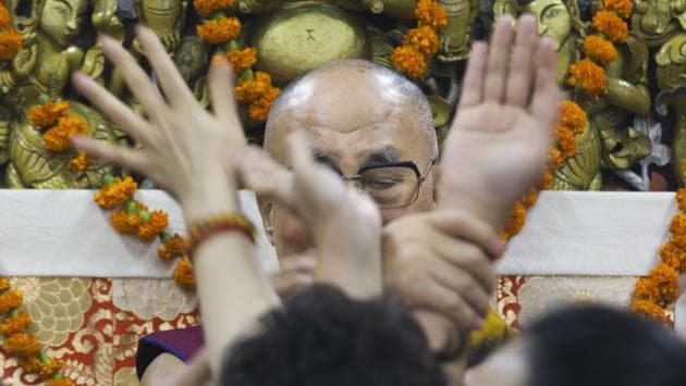 Tibetan spiritual leader the Dalai Lama shuts his eyes as devotees crowd around him before a group photograph at the Tsuglakhang temple in Dharmsala. The four-day religious discourse by the Tibetan leader for Buddhist groups from Southeast Asian countries ended Friday. (Ashwini Bhatia / AP) Tibetan spiritual leader the Dalai Lama shuts his eyes as devotees crowd around him before a group photograph at the Tsuglakhang temple in Dharmsala. The four-day religious discourse by the Tibetan leader for Buddhist groups from Southeast Asian countries ended Friday. (Ashwini Bhatia / AP)