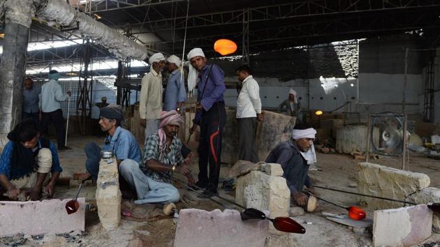 Workers at a glass factory in Firozabad. India’s economic growth slipped to a three-year low of 5.7% in April-June following disruptions caused by demonetisation. (AFP) Workers at a glass factory in Firozabad. India’s economic growth slipped to a three-year low of 5.7% in April-June following disruptions caused by demonetisation. (AFP)