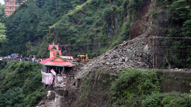 Rubble blocks the Chandigarh-Shimla national highway after a landslide buried at least six vehicles next to a temple in Bhattakufer, in the Indian state of Himachal Pradesh. (AFP) Rubble blocks the Chandigarh-Shimla national highway after a landslide buried at least six vehicles next to a temple in Bhattakufer, in the Indian state of Himachal Pradesh. (AFP)