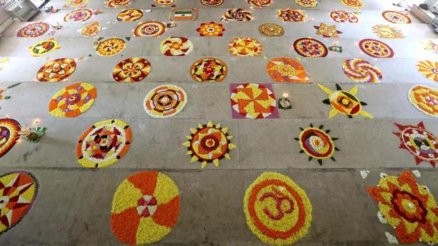 Women create floral patterns as part of Pookalam competitions. Being a harvest festival and a family affair, on Thiruonam it’s mostly a family affair with families confined to their homes and attending to guests serving traditional Onam Sadhhya- a feast involving traditional delicacies cooked with vegetables and spices from Kerala and payasam- sweet dish. (Vivek Nair / HT Photo) Women create floral patterns as part of Pookalam competitions. Being a harvest festival and a family affair, on Thiruonam it’s mostly a family affair with families confined to their homes and attending to guests serving traditional Onam Sadhhya- a feast involving traditional delicacies cooked with vegetables and spices from Kerala and payasam- sweet dish. (Vivek Nair / HT Photo)