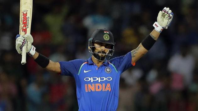 Virat Kohli, Indian cricket team captain, raises his bat after scoring a century against Sri Lanka in Colombo.(AP)