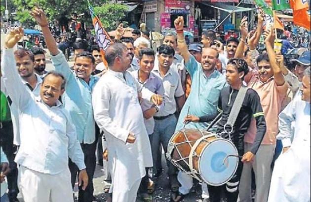BJP workers celebrating the induction of new faces in the cabinet. BJP workers celebrating the induction of new faces in the cabinet.