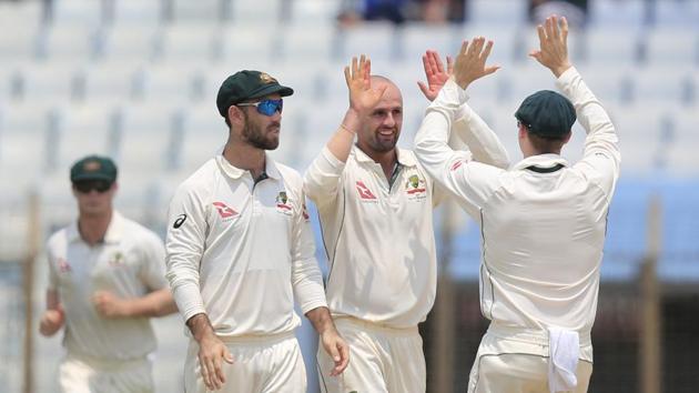 Australia's Nathan Lyon, second right, picked up five wickets on the first day of the second Test against Bangladesh in Chittagong on Monday. Get full cricket score of Bangladesh vs Australia, 2nd Test, Day 1, here.(AP)