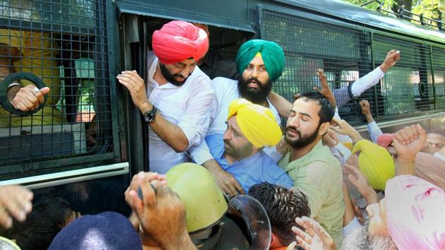 Aam Aadmi Party leaders being taken to Sector 17 police station in Chandigarh on Monday. (Keshav Singh/HT) Aam Aadmi Party leaders being taken to Sector 17 police station in Chandigarh on Monday. (Keshav Singh/HT)