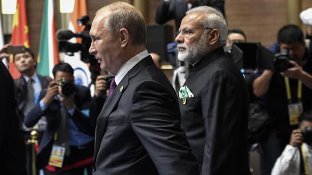Russian President Vladimir Putin (L) and Indian Prime Minister Narendra Modi arrive at the plenary session during the BRICS Summit at the Xiamen International Conference and Exhibition Centre in Xiamen, China. On Monday, Modi met Russian President Vladimir Putin followed by a meeting with President Michael Temer of Brazil. (Fred Dufour / AFP)