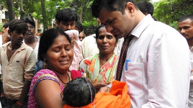 This file photo taken on August 12, 2017 shows relatives mourning the death of a child at the Baba Raghav Das Hospital in Gorakhpur, in the state of Uttar Pradesh.(AFP File Photo)