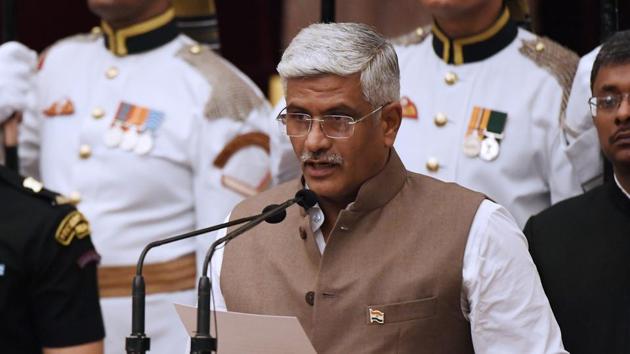 Bhartiya Janata Party politician Gajendra Singh Shekhawat takes oath during the swearing-in ceremony of new ministers at the Presidential Palace in New Delhi on Sunday. (AP) Bhartiya Janata Party politician Gajendra Singh Shekhawat takes oath during the swearing-in ceremony of new ministers at the Presidential Palace in New Delhi on Sunday. (AP)