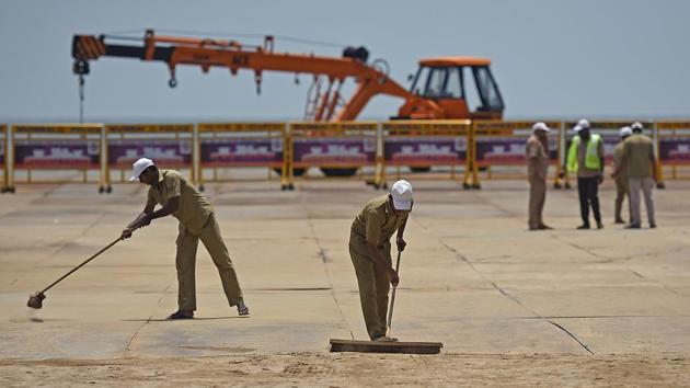 SPIC-AND-SPAN: Workers clean the road. (Satyabrata Tripathy/HT Photo) 