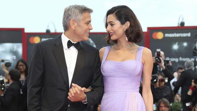 George Clooney has eyes only for wife Amal in first public ...