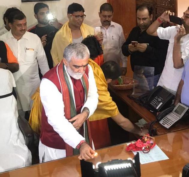 Health minister Ashwini Choubey performing puja on the first day of his office in New Delhi. Health minister Ashwini Choubey performing puja on the first day of his office in New Delhi.
