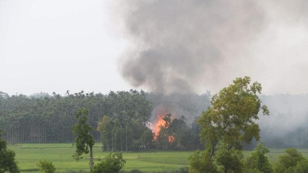 Smoke rises from what is believed to be a burning village in the southern Maungdaw area of Myanmar's Rakhine state on September 4, 2017. (AFP Photo) Smoke rises from what is believed to be a burning village in the southern Maungdaw area of Myanmar's Rakhine state on September 4, 2017. (AFP Photo)