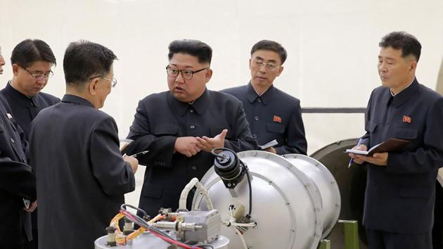 This undated picture released by North Korea's official Korean Central News Agency (KCNA) on September 3, 2017 shows North Korean leader Kim Jong-Un (C) looking at a metal casing with two bulges at an undisclosed location.(AFP Photo) This undated picture released by North Korea's official Korean Central News Agency (KCNA) on September 3, 2017 shows North Korean leader Kim Jong-Un (C) looking at a metal casing with two bulges at an undisclosed location.(AFP Photo)