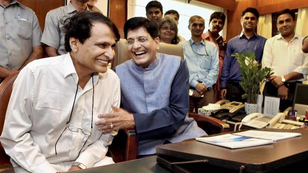 New Railways Minister Piyush Goyal takes charge from his predecessor Suresh Prabhu at Rail Bhawan in New Delhi on Monday. (PTI) New Railways Minister Piyush Goyal takes charge from his predecessor Suresh Prabhu at Rail Bhawan in New Delhi on Monday. (PTI)