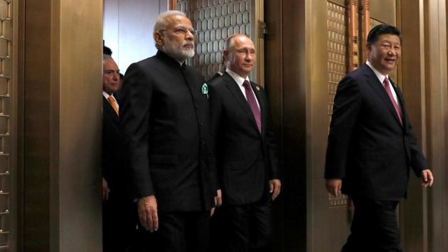 Indian Prime Minister Narendra Modi, Russian President Vladimir Putin and Chinese President Xi Jinping attend a plenary session of BRICS Summit in Xiamen, China. (REUTERS)
