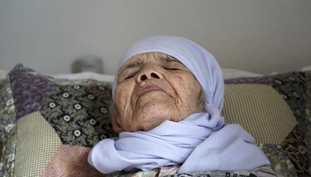 106-year old Afghan refugee Bibihal Uzbeki lies in bed in Hova, Sweden, Sunday, Sept. 3, 2017, and despite being severely disabled and barely able to speak, she is facing deportation from Sweden after her asylum application was rejected.(AP)