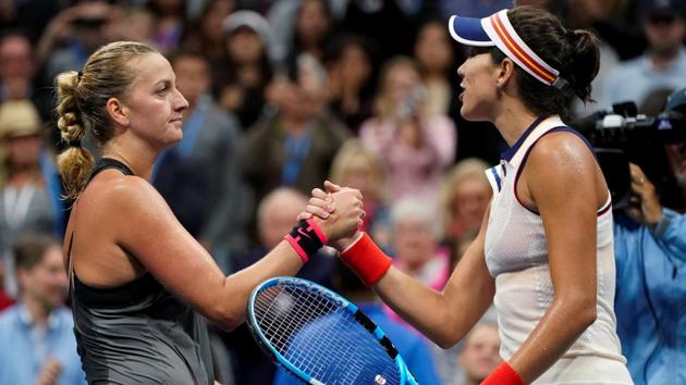Petra Kvitova of the Czech Republic (L) shakes hands with Garbine Muguruza of Spain after she defeated her during their fourth round match at US Open in New York.(Reuters)