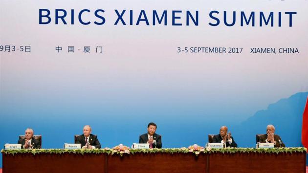 Chinese President Xi Jinping (C) delivers his speech while flanked by Brazilian President Michel Temer (L), Russian President Vladimir Putin (2nd L), South Africa's President Jacob Zuma (2nd R), and Indian Prime Minister Narendra Modi (R) during the BRICS Business Council signing ceremony at the BRICS Summit in Xiamen, China on Monday. (PTI Photo) Chinese President Xi Jinping (C) delivers his speech while flanked by Brazilian President Michel Temer (L), Russian President Vladimir Putin (2nd L), South Africa's President Jacob Zuma (2nd R), and Indian Prime Minister Narendra Modi (R) during the BRICS Business Council signing ceremony at the BRICS Summit in Xiamen, China on Monday. (PTI Photo)