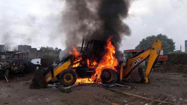 One of the JCB machines that was set on fire by an irate mob in Patna on Tuesday. (HT photo) One of the JCB machines that was set on fire by an irate mob in Patna on Tuesday. (HT photo)
