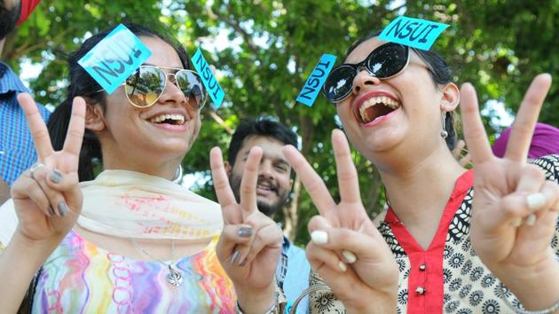 Girls supporting NSUI during election campaigning at Panjab University. (Anil Dayal/HT)