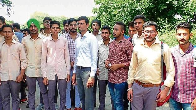 Students at the district administrative complex in Sirsa on Monday.(HT Photo)