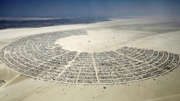 Black Rock City, a gathering of approximately 70,000 people that is created annually for the Burning Man arts and music festival dedicated to community, art, self-expression, and self-reliance, is seen in the Black Rock Desert of Nevada. This temporary city emerges every year and is dismantled after the festival, leaving behind no trace of its existence. (Jim Bourg / REUTERS) 