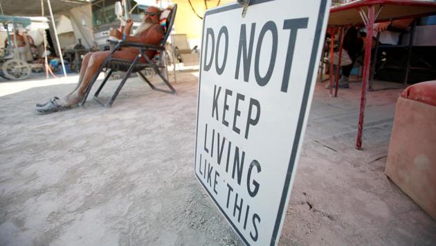A sign at a theme camp lends words of wisdom for posterity to burners taking part in the 2017 Burning Man celebrations. (Jim Urquhart / REUTERS) 