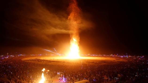 The Man is engulfed in flames with revellers surrounding it during the signature ceremony marking the end of the annual Burning Man arts and music festival in the Black Rock Desert of Nevada. (Jim Urquhart / REUTERS) 