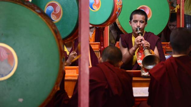 Young monks play traditional musical instruments during the prayer for their spiritual guru Kyabje Taklung Tretrul Rinpochhe. ‘We pray that the master is reborn. The process to find his reincarnation will start in October,’ says Yarphel Lama, the administrator of the monastery. (Deepak Sansta / HT Photo) Young monks play traditional musical instruments during the prayer for their spiritual guru Kyabje Taklung Tretrul Rinpochhe. ‘We pray that the master is reborn. The process to find his reincarnation will start in October,’ says Yarphel Lama, the administrator of the monastery. (Deepak Sansta / HT Photo)