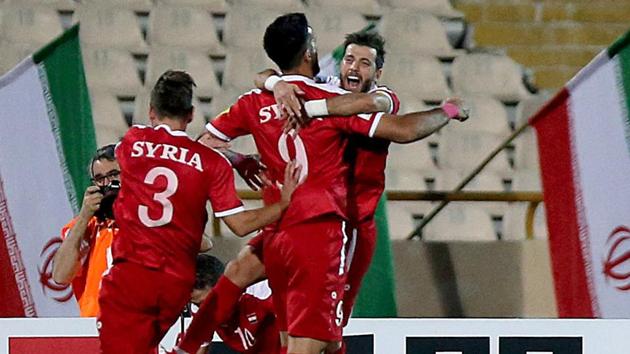 Syria's players celebrate after scoring a goal against Iran during the FIFA World Cup 2018 qualification football match against Iran at the Azadi Stadium in Tehran on Tuesday. (AFP) Syria's players celebrate after scoring a goal against Iran during the FIFA World Cup 2018 qualification football match against Iran at the Azadi Stadium in Tehran on Tuesday. (AFP)