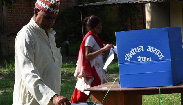 A Nepalese voter casts his ballot at a polling station in Nepalgunj. The Parliament has endorsed electoral laws which bar people involved in corruption and criminal offences to stand as candidates. (AFP) A Nepalese voter casts his ballot at a polling station in Nepalgunj. The Parliament has endorsed electoral laws which bar people involved in corruption and criminal offences to stand as candidates. (AFP)