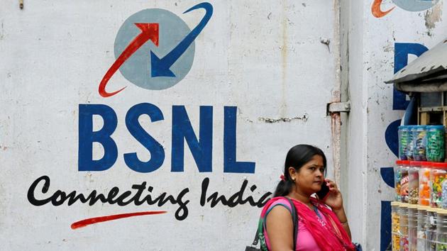 A woman speaks on her phone outside the BSNL office in Kolkata. BSNL has launched a new voice and data plan.(REUTERS)
