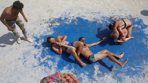 Participants compete in blindfolded oiled wrestling during the 2017 Burning Man arts and music festival in the Black Rock Desert of Nevada, United States. (Jim Urquhart / REUTERS) 