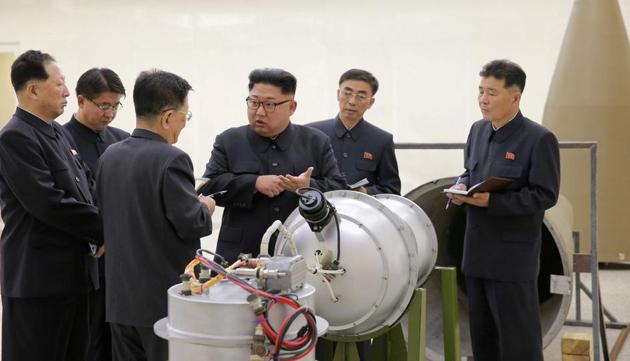 North Korean leader Kim Jong Un provides guidance with Ri Hong Sop (3rd L) and Hong Sung Mu (L) on a nuclear weapons program in this undated photo released by North Korea's Korean Central News Agency (KCNA) in Pyongyang September 3, 2017.(Reuters File Photo)