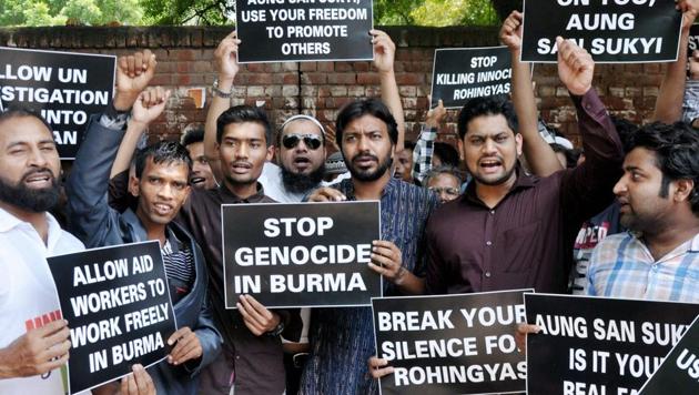 Rohingya Muslim refugees hold placards and raise slogans against human rights violations in Myanmar during a protest at Jantar Mantar, in New Delhi on Tuesday.(PTI Photo)