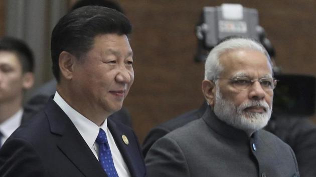 Prime Minister Narendra Modi and Chinese President Xi Jinping arrive for the Dialogue of Emerging Market and Developing Countries on the sideline of the BRICS Summit in Xiamen.(AP Photo)