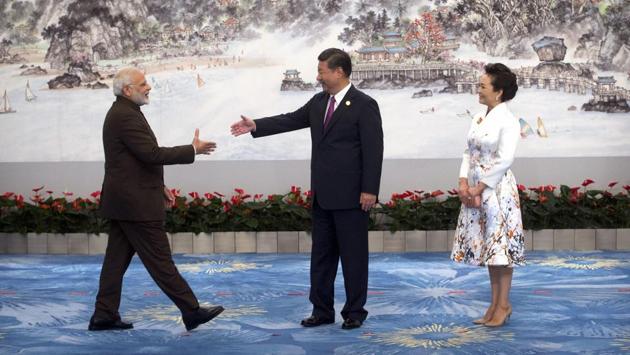 Chinese President Xi Jinping(L) and Prime Minister Narendra Modi greet each other for a banquet dinner at the 2017 BRICS Summit in Xiamen, China. The BRICS (Brazil, Russia,India,China and South Africa) emerged out of a global order dominated and managed by the United States post disintegration of the Soviet Union. BRICS came about as a vehicle to respond to this and together they hoped, they would be able to loosen the vice-like grip the Atlantic system had on existing governance institutions. (AP)