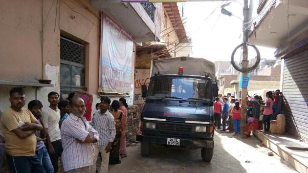 People gathered outside Vinod Puniya’s house at Nihal Vihar in west Delhi on Tuesday. People gathered outside Vinod Puniya’s house at Nihal Vihar in west Delhi on Tuesday.
