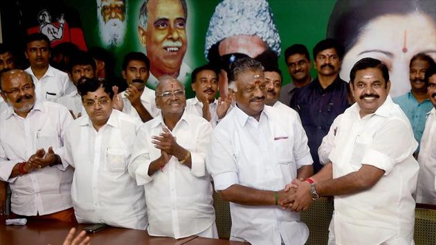 Tamil Nadu Chief Minister K Palaniswami (R) and O Panneerselvam exchange greetings following merger of their factions in Chennai.(PTI File Photo)