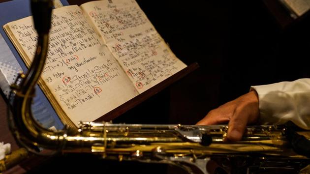 Seen here are music notes of a member of the ‘Old Jazz Band’ kept open during his performance in Shanghai. Former US presidents Bill Clinton and Ronald Reagan are among the dignitaries who dropped in for an evening of jazz -- Clinton, who plays the sax, even joined in.The band, which has an average age of 82, plays what it calls ‘soft jazz’ with a Shanghainese flavour. (Chandan Khanna / AFP) Seen here are music notes of a member of the ‘Old Jazz Band’ kept open during his performance in Shanghai. Former US presidents Bill Clinton and Ronald Reagan are among the dignitaries who dropped in for an evening of jazz -- Clinton, who plays the sax, even joined in.The band, which has an average age of 82, plays what it calls ‘soft jazz’ with a Shanghainese flavour. (Chandan Khanna / AFP)