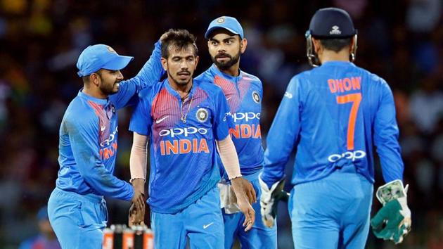 Virat Kohli celebrates with Yuzvendra Chahal after the fall of a Sri Lanka batsman in the one-off T20. (REUTERS) Virat Kohli celebrates with Yuzvendra Chahal after the fall of a Sri Lanka batsman in the one-off T20. (REUTERS)